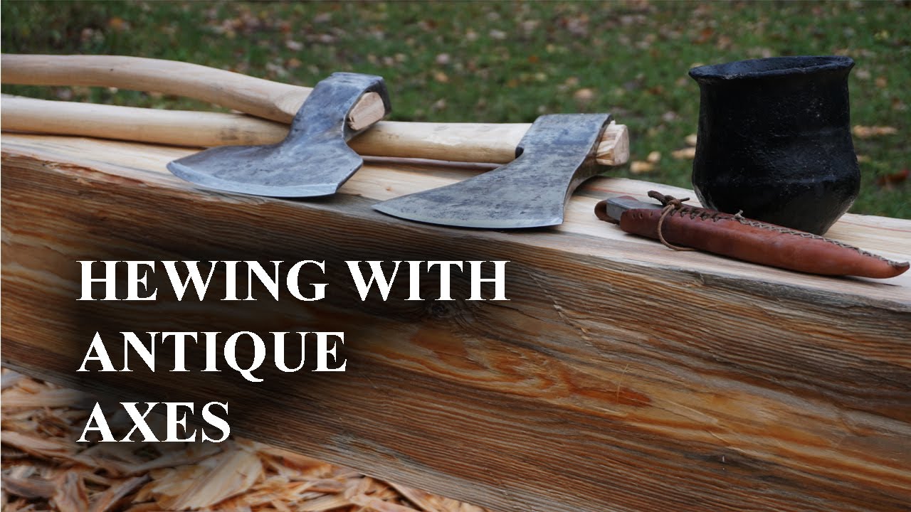 Hewing a pine with two new antique axes