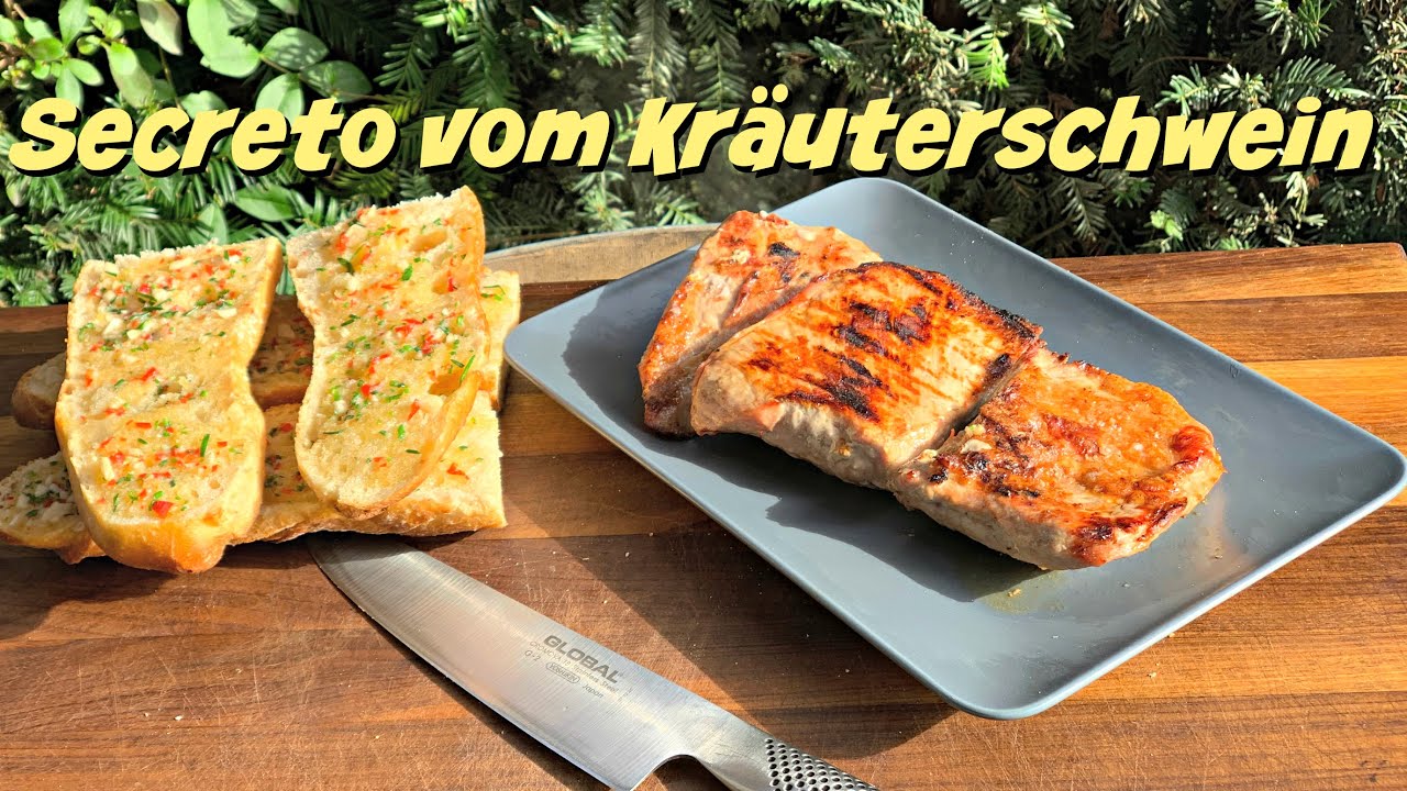 Secreto vom Kräuterschwein mit Knoblauch-Chili Baguette