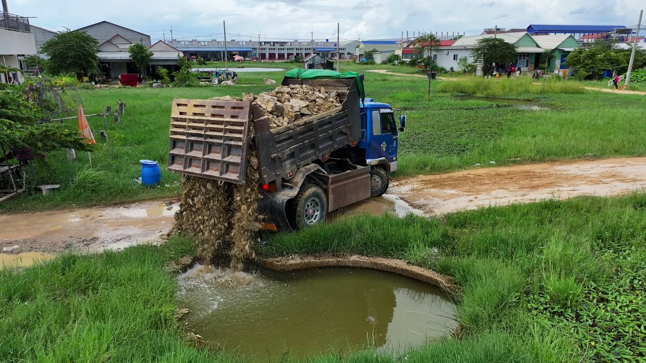 Full VDO Excellent work Land filling !! Bulldozer Komatsu D20P pushed Stone with Truck 5-Ton Deliver