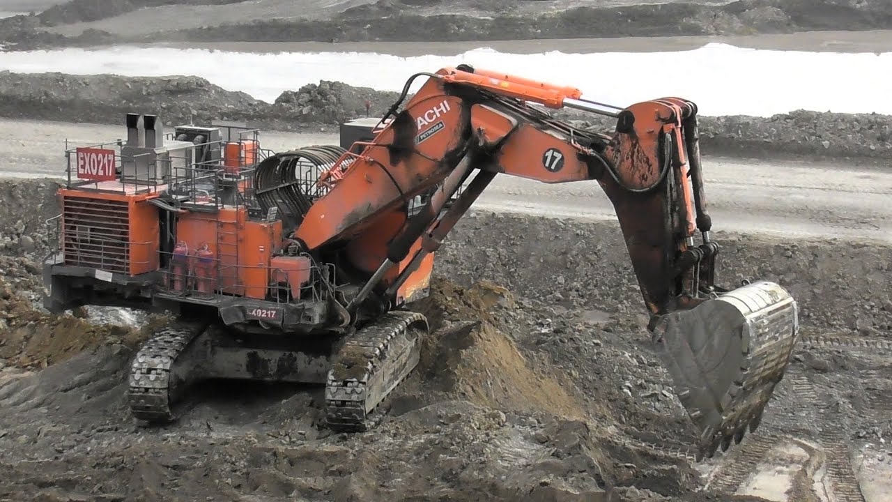 Hitachi EX2600 Excavator Starts in Action Loading Overburden into Dumpers
