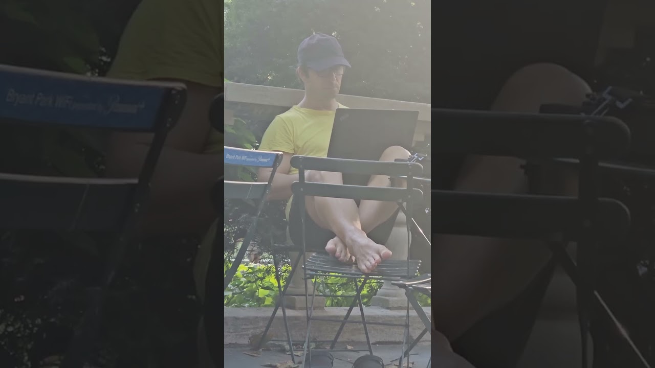 Candid White Guy Airs Out Bare Feet After Taking off Clogs