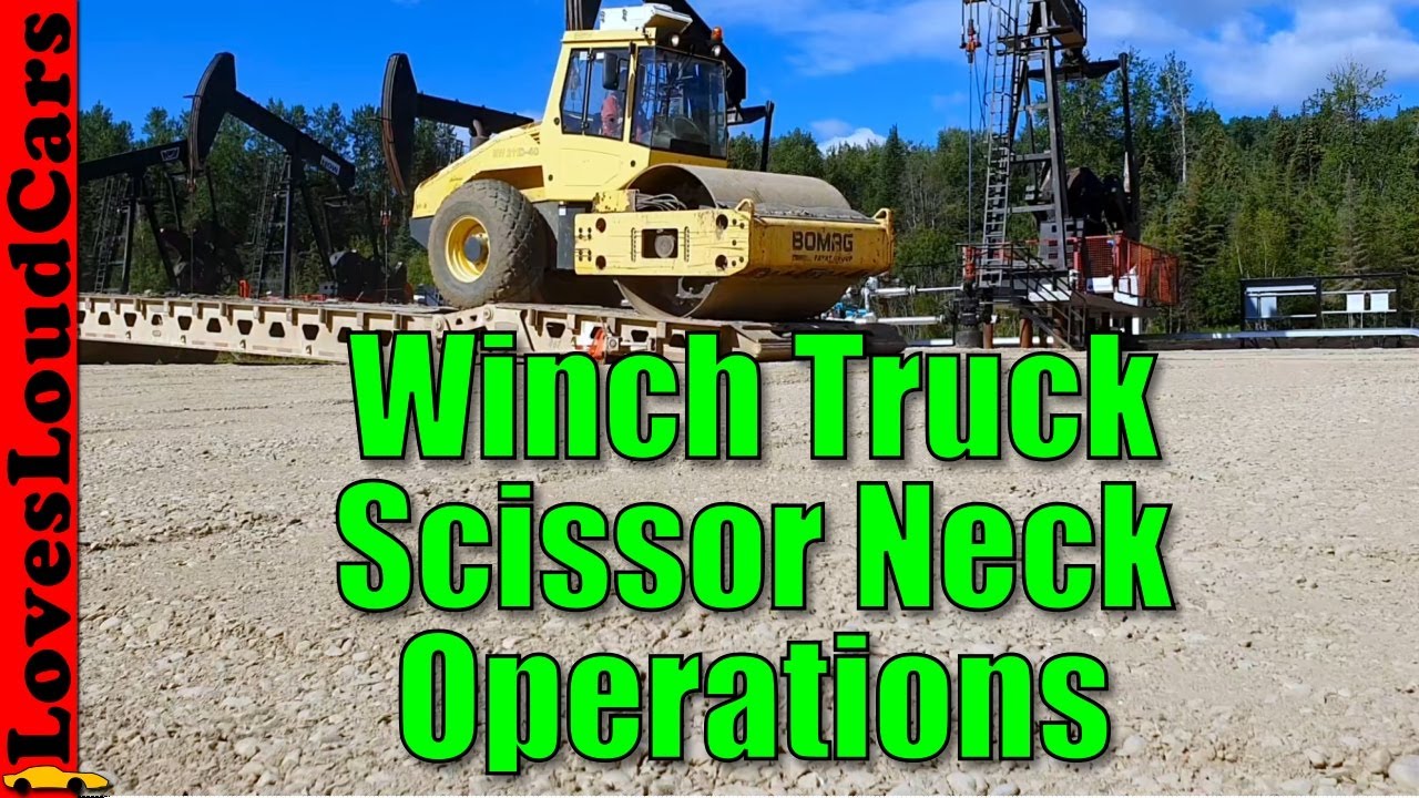 Loading a packer on a winch truck scissor neck trailer combo