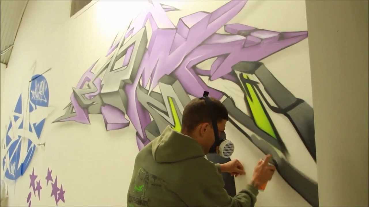 Aerosol Artist 'Astek' spray painting the walls of the Underdog Gallery