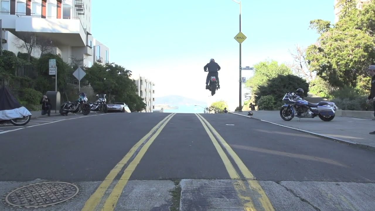 Harley Jumps Road Gap in SF (Wheelie Pig)