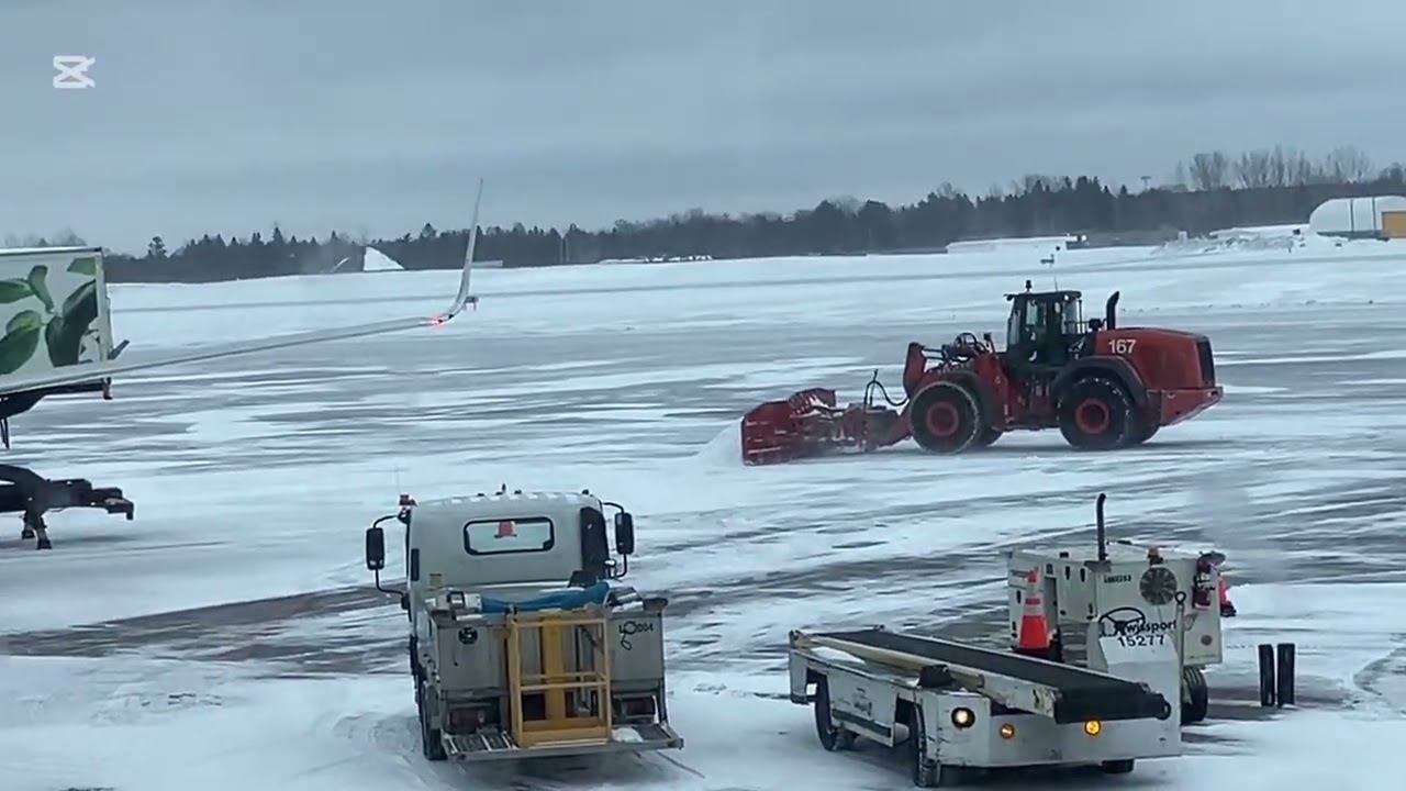 Case Construction 1021F plowing YOW runway