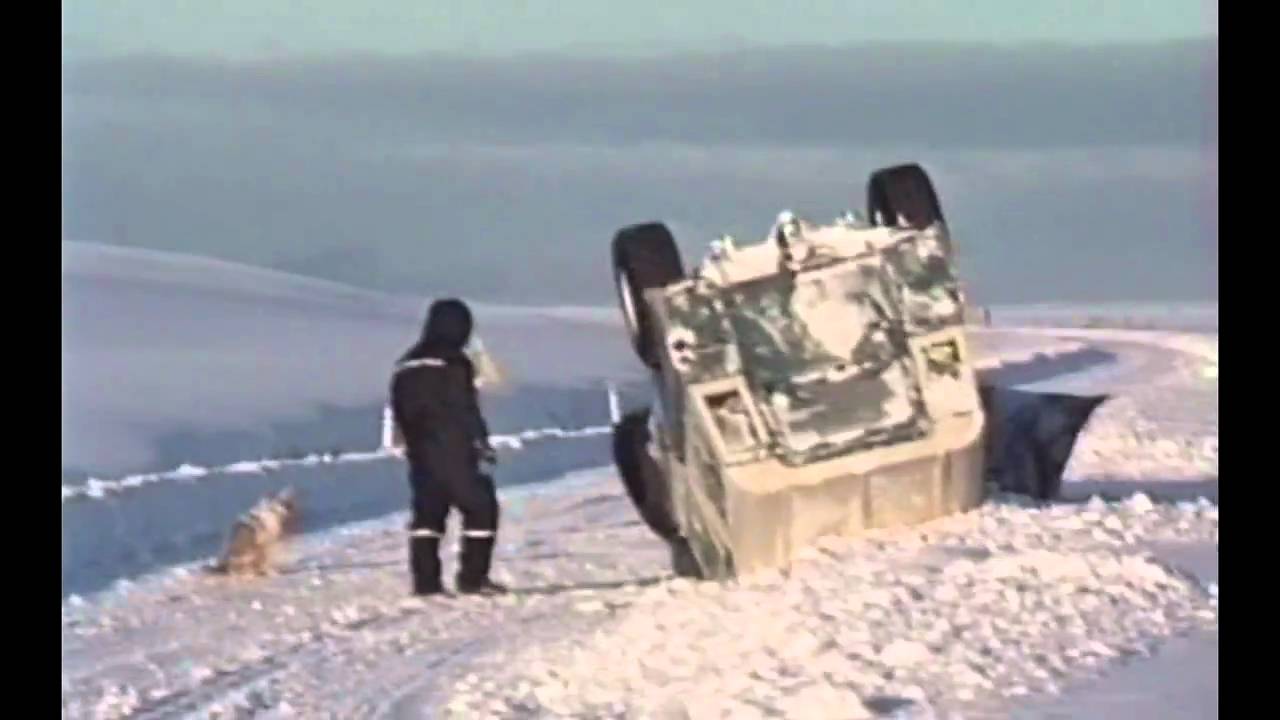 Old LAND ROVER with snow plow.