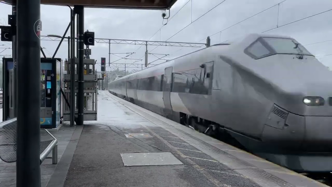 Flytoget to Oslo airport passes Lillestrøm stasjon at very high speeds
