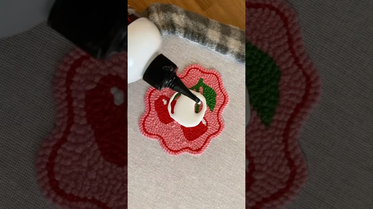 Securing punch needle with glue 🍒 #embroidery #diy #craft #crochet #shortvideo #punchneedle #mugrug