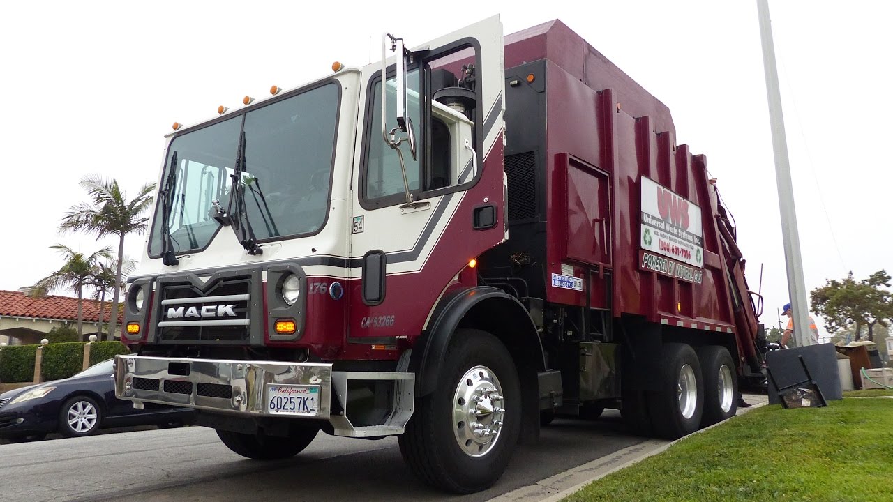 Red Rear-Load Garbage Trucks Eatin’ Bulk