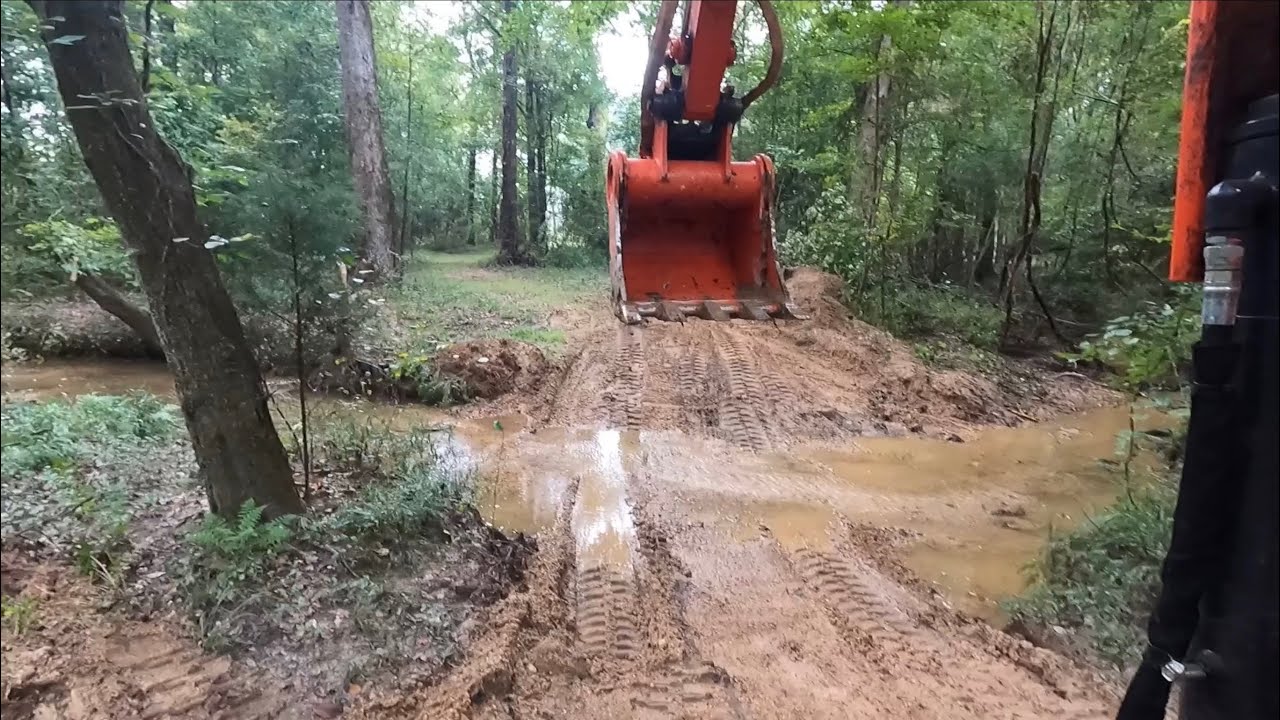 Doing maintenance on a creek crossing with the excavator