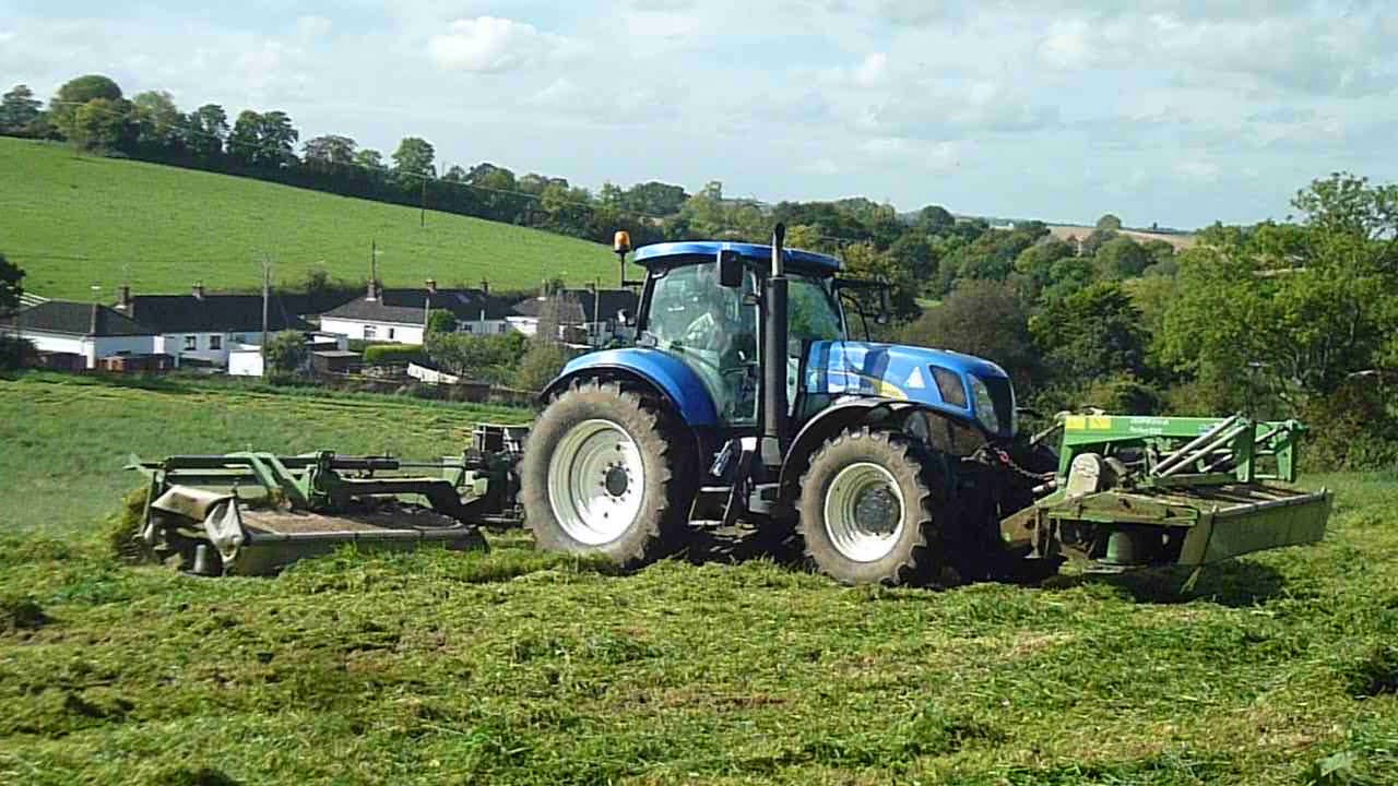 New Holland T7050 with triple mowers