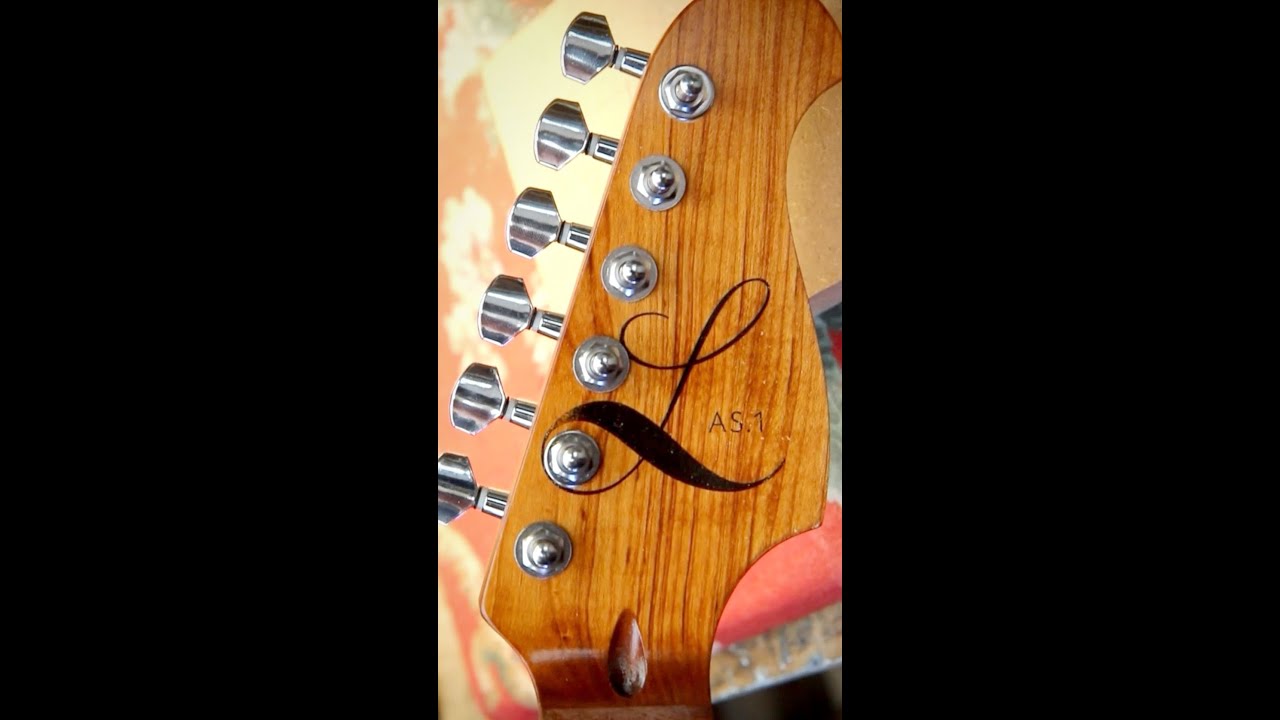 How to apply a Water Slide Decal to your guitar headstock