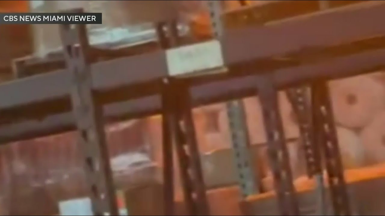 Firefighters continue to fight the Miami-Dade warehouse fire one day after the blaze