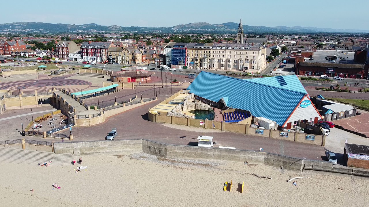 RHYL BEACH FROM THE AIR FILMED USING DJI DRONE.ON A SUNNY DAY WITH THE FAMILY HAVING FUN