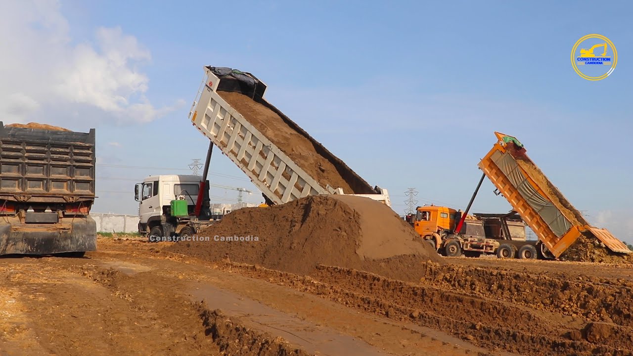 Donfeng Trucks Dumping Sand & Dozer pushes the sand down