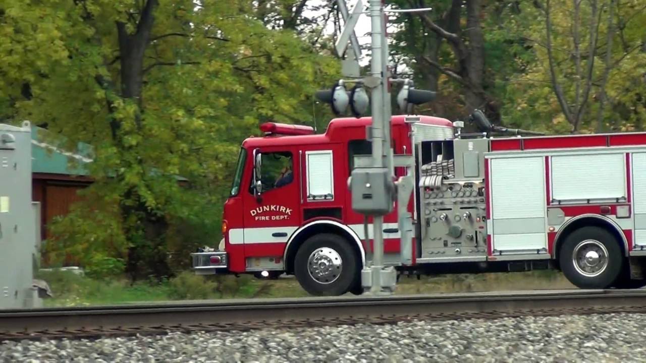 Fire Truck Waits For Train at Crossing Gate