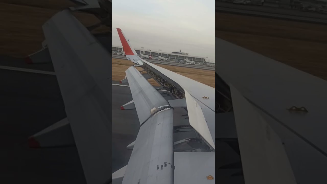 This is how looks like of airplane flaps/spoiler when descending and touching down/Jetstar