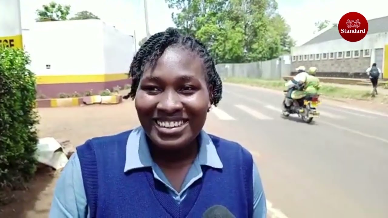 A nurse student at Kitale Medical Training college warms hearts for entertaining sick child in ward