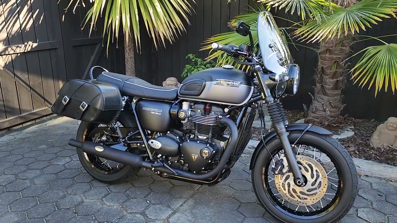 Triumph T120 Black with long haul fly screen way to much wind noise NZ.