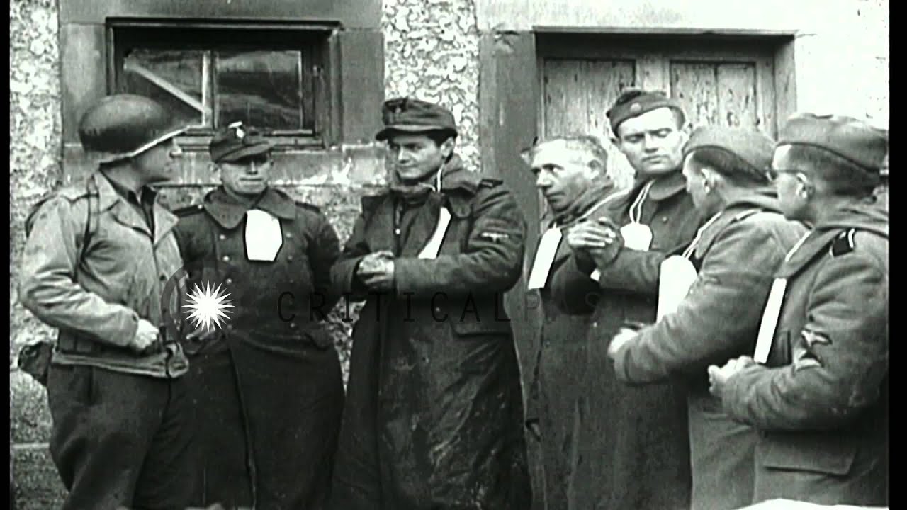 U.S. Army soldiers guard German SS-Totenkopfverbände (SS-TV) prisoners...HD Stock Footage