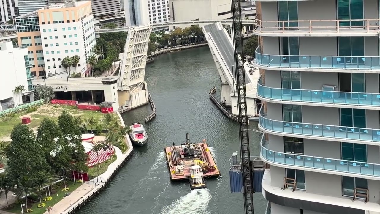 Pushboat Moving A Barge With A Crane Headed Out Of The Miami River
