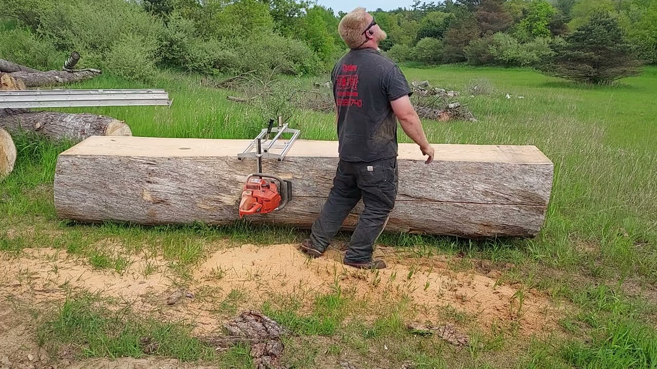 Chainsaw milling an oak log with a 394xp and a 36