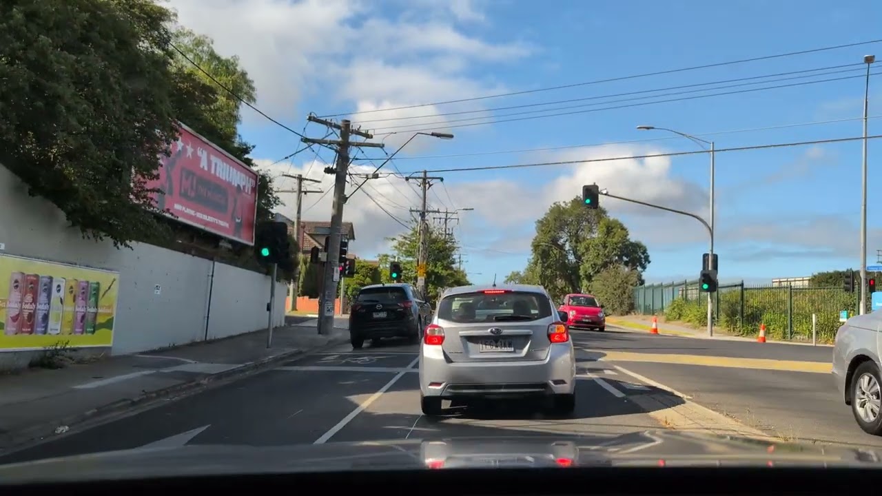 Cars traveling the road