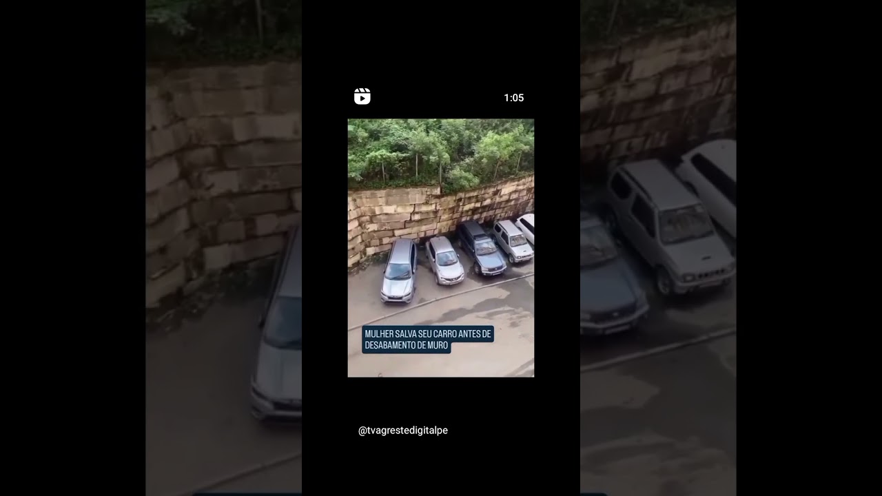 Mulher salva carro e muro cai