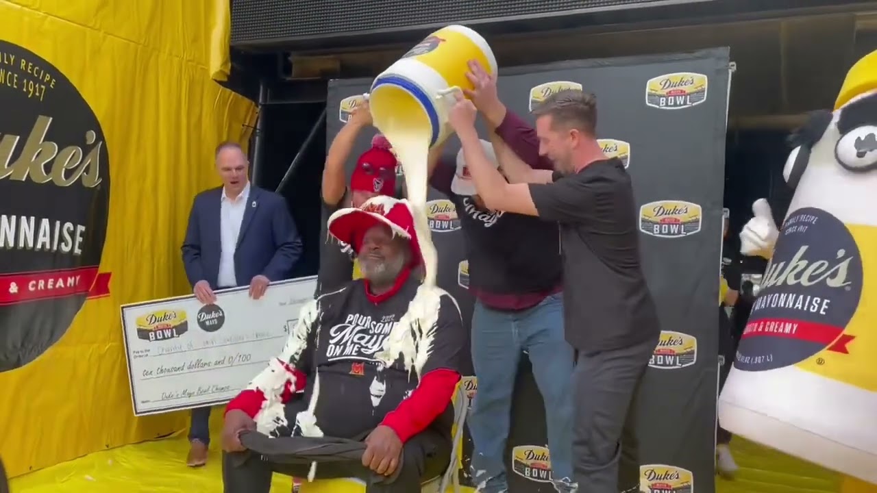 Maryland coach Mike Locksley gets the mayonnaise bath at the Duke&rsquo;s Mayo Bowl