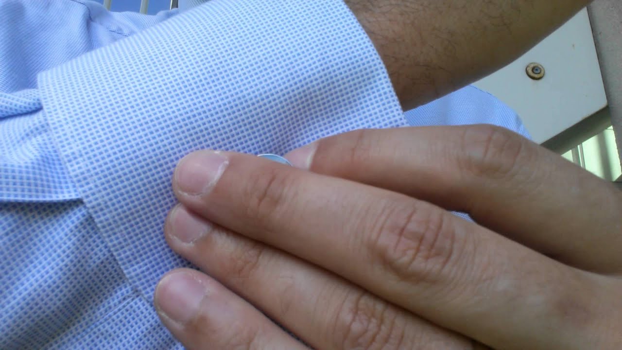 Comment mettre des boutons de manchette?