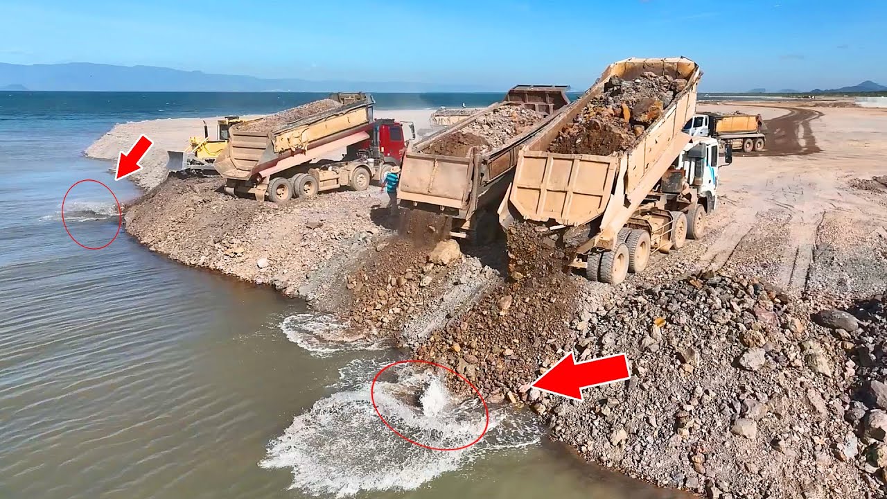 Be ho Huge Land Reclamation Process Dump Truck Management Unloading Rock Dirt Dozer Pushing Stone