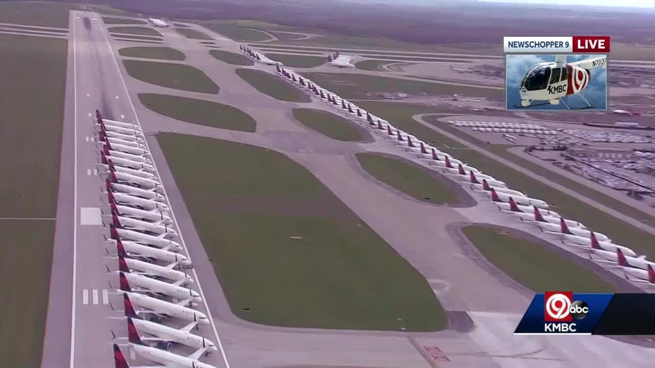 Delta Airlines parking planes on runway at KCI Airport