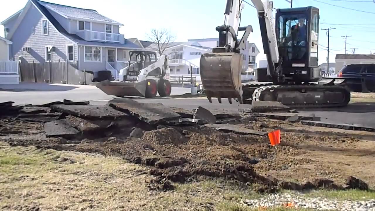 Bobcat E50 Ripping Up Asphalt Driveway