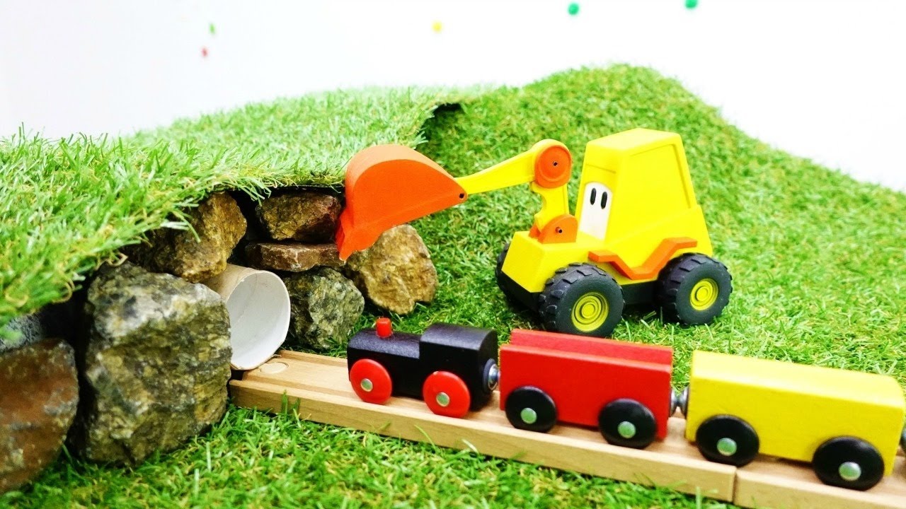 Spielzeug aus Holz: Max der Bagger baut einen Tunnel.