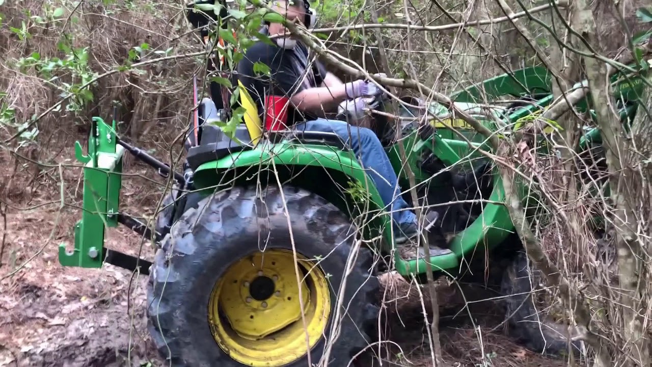 The John Deere 3025e Tractor and Grapple