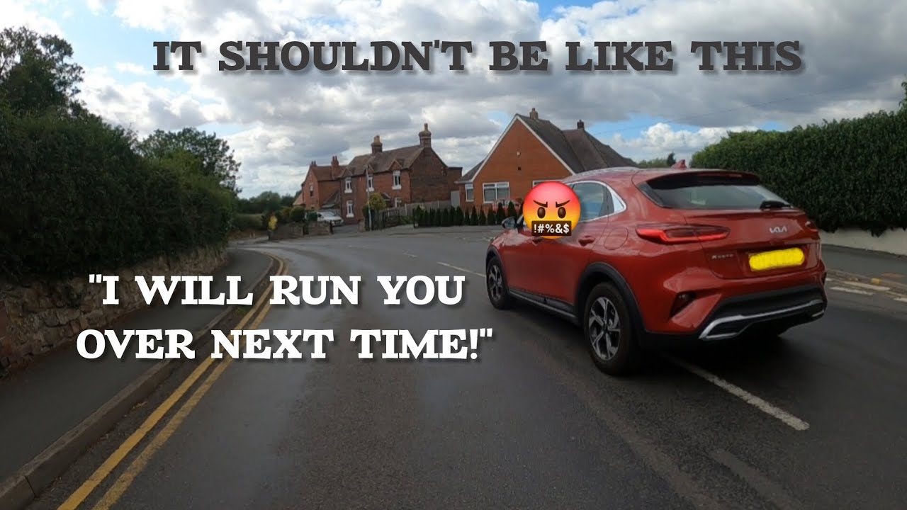 Road Rage. Driver threatens cyclists for cycling in the road. 