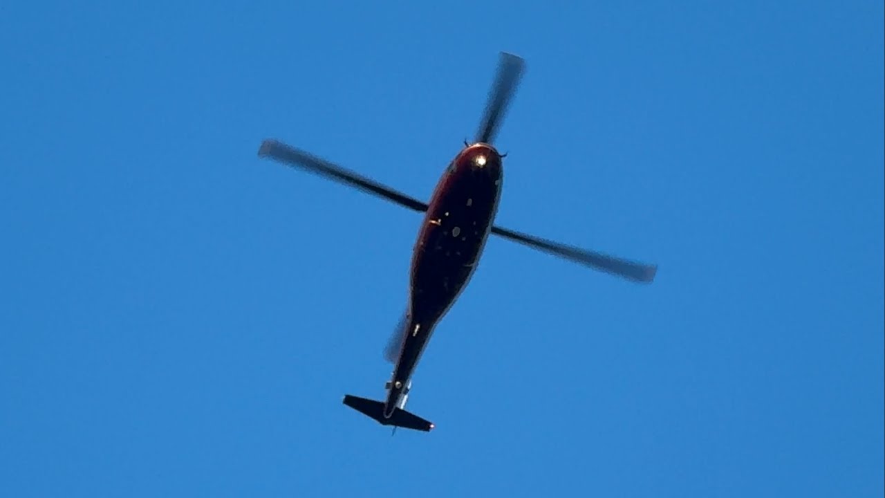 Private Sikorsky S76 [G-XXEB] flying overhead during the evening