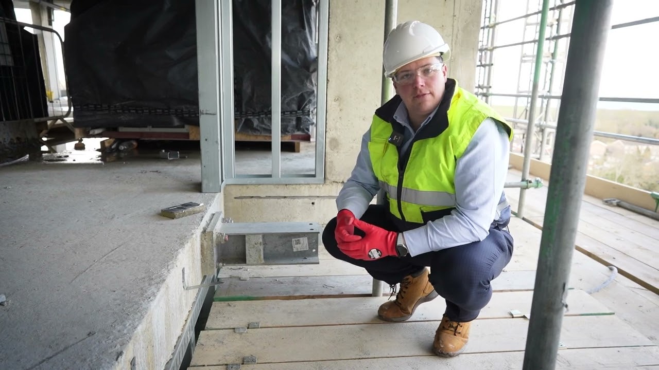 How do you maintain continuity of a fire barrier when it is penetrated by structural connections?