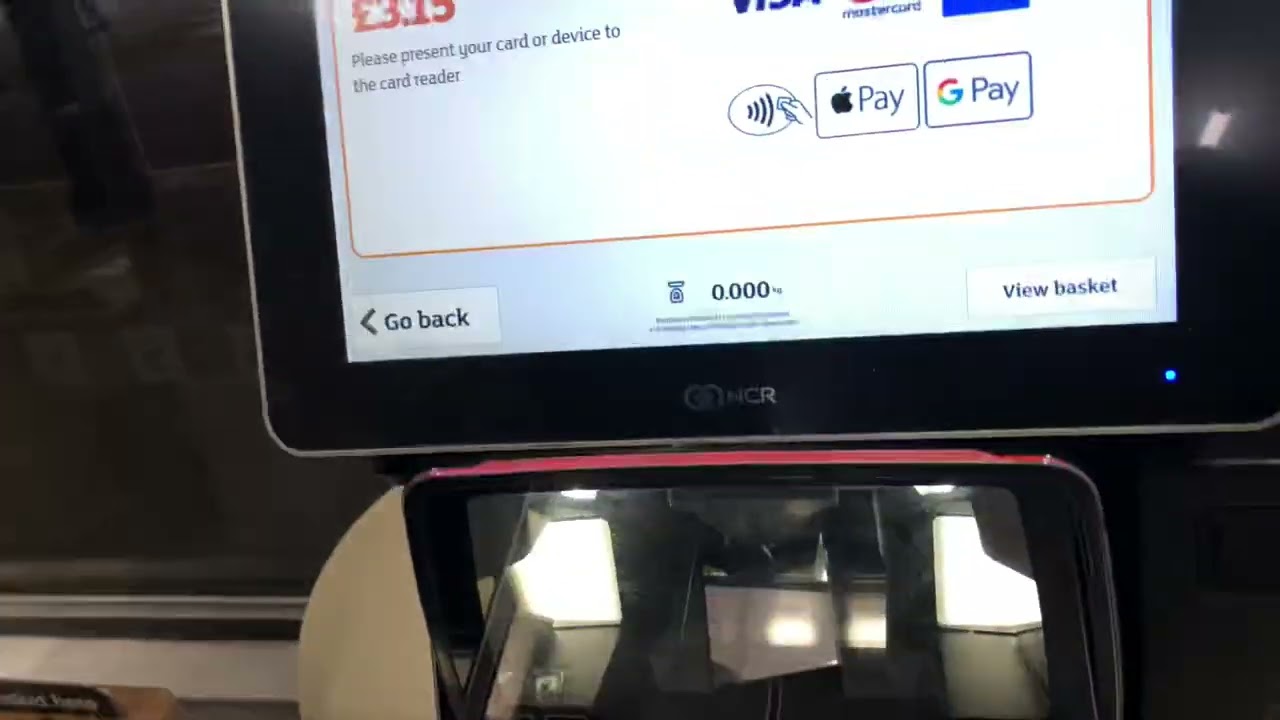 Sainsbury Local store NCR self check out machine in London Queenways