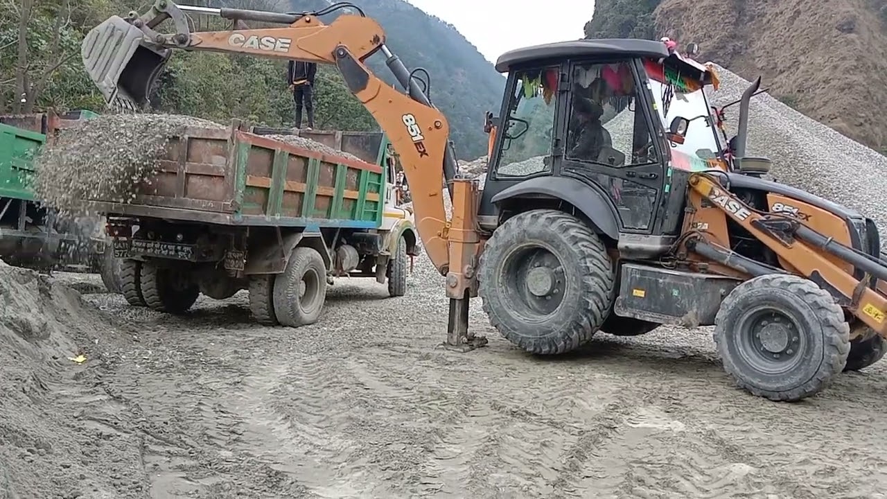 Loading ballast sand in crusher Case backhoe loader in Tata Nake Tipper Baglung nepal