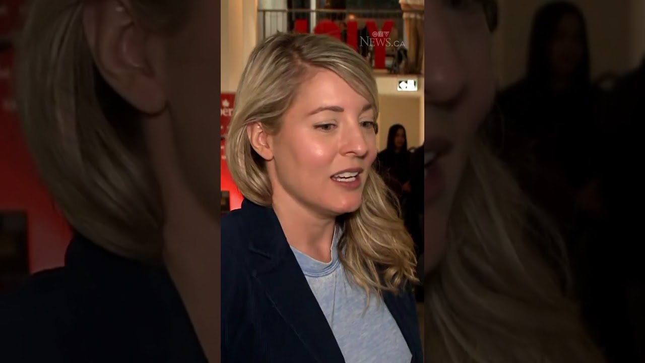 Liberal candidate Melanie Joly reacts to early election results