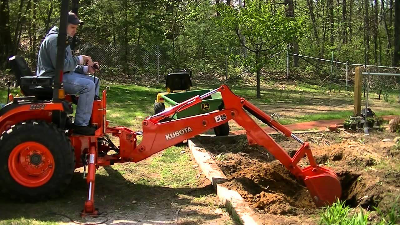 Installing a small water garden pond...With the Kubota B2920...