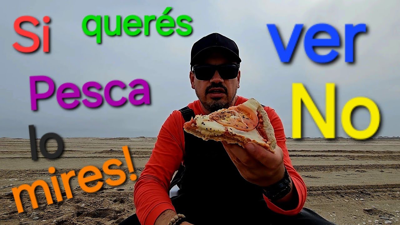 Invierno, comiendo pizza en la playa, con intento de pesca...