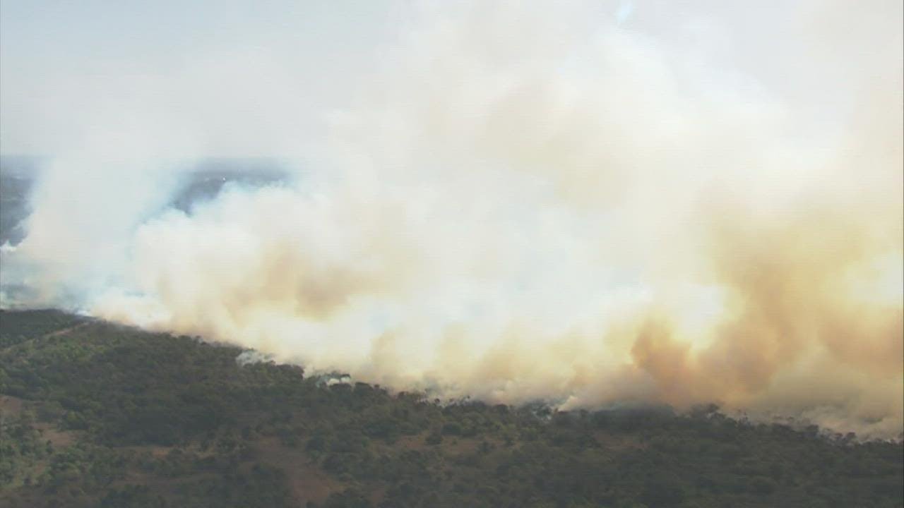 Multiple fire crews battle a brush fire at Camp Bullis