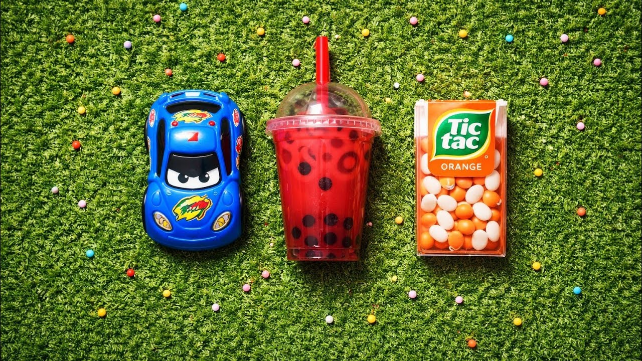 Relaxing ASMR Candy Toys Compilation on Green Grass Background