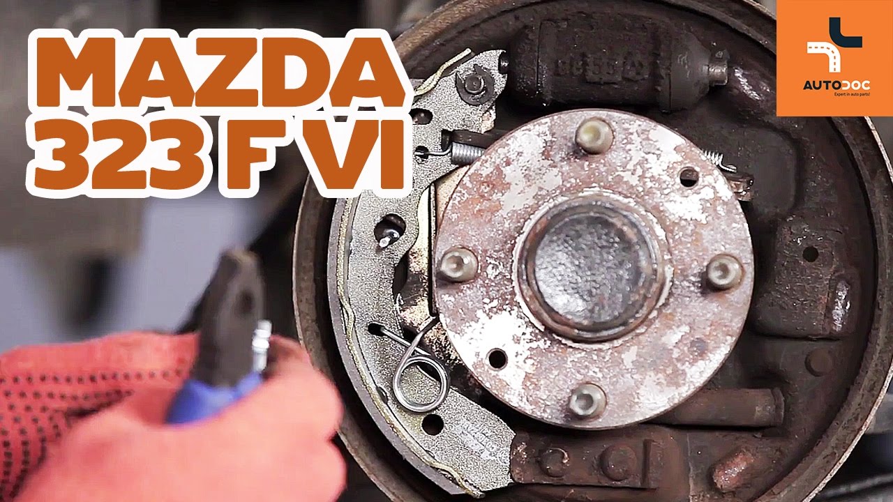 How to change rear brake drums and rear brake pads on MAZDA 323 TUTORIAL | AUTODOC