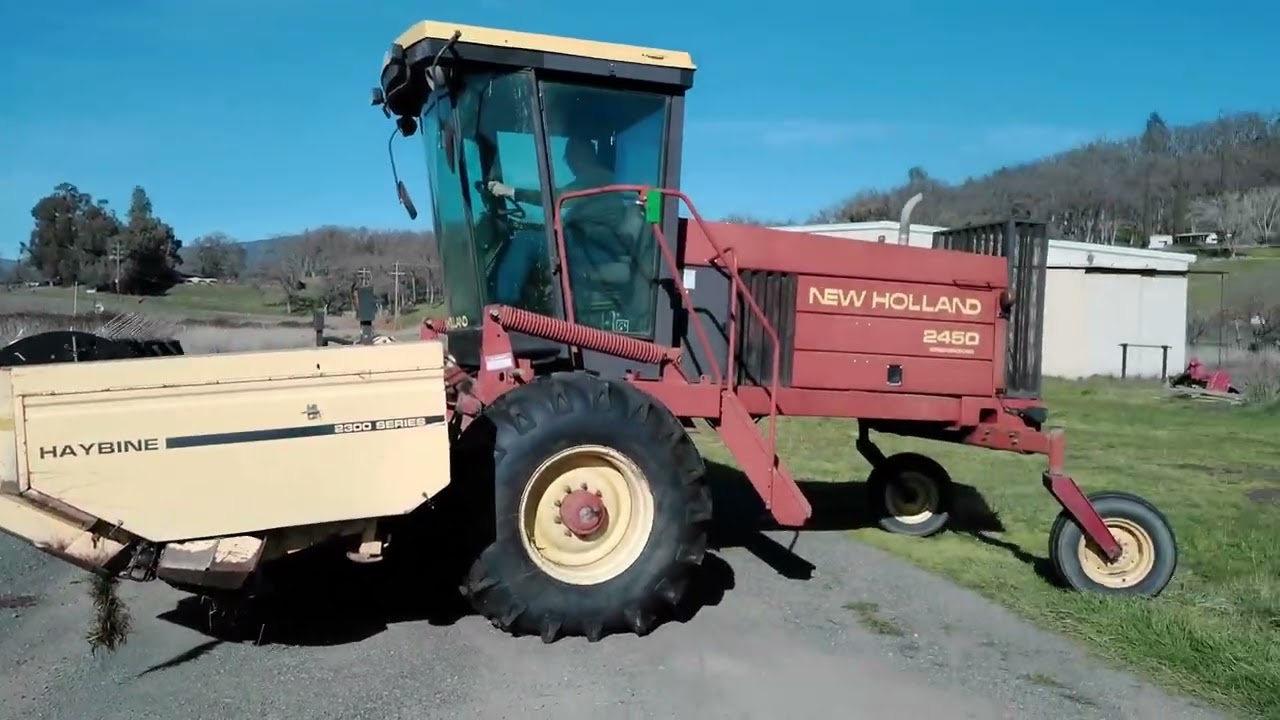 Lot # 0100: New Holland 2450 Swather