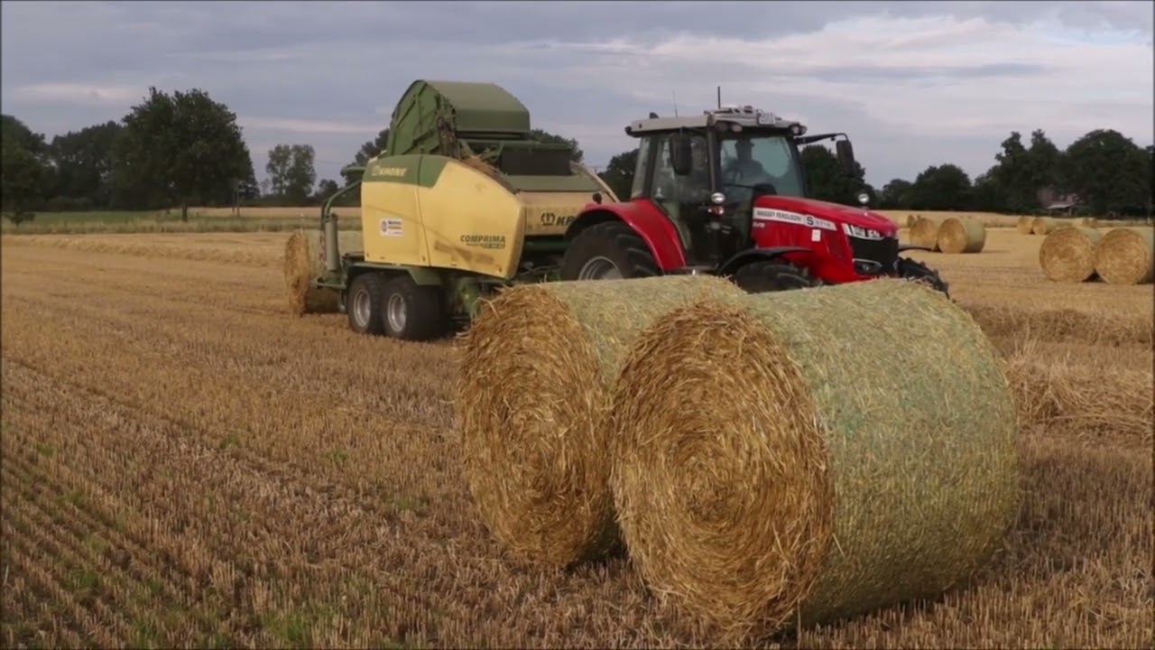 MF 6718 S mit Krone Comprima im Weizenstroh!