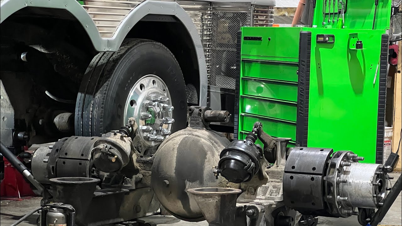 Removing the entire rear axle assembly on a vintage 1969 mci bus.