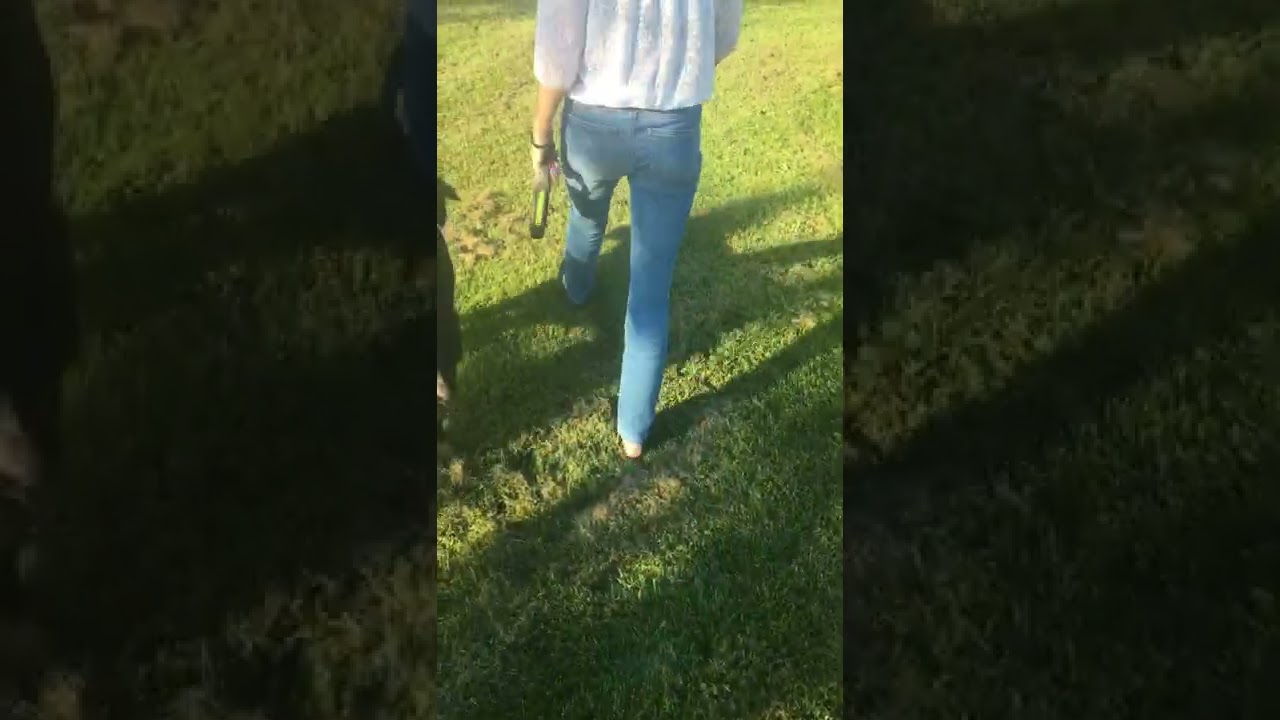 Walking with one shoe on and one shoe of, one bare foot
